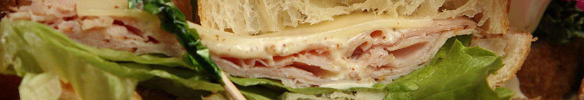 Eating Pizza Sandwich at Fox's Pizza Den restaurant in Pitcairn, PA.